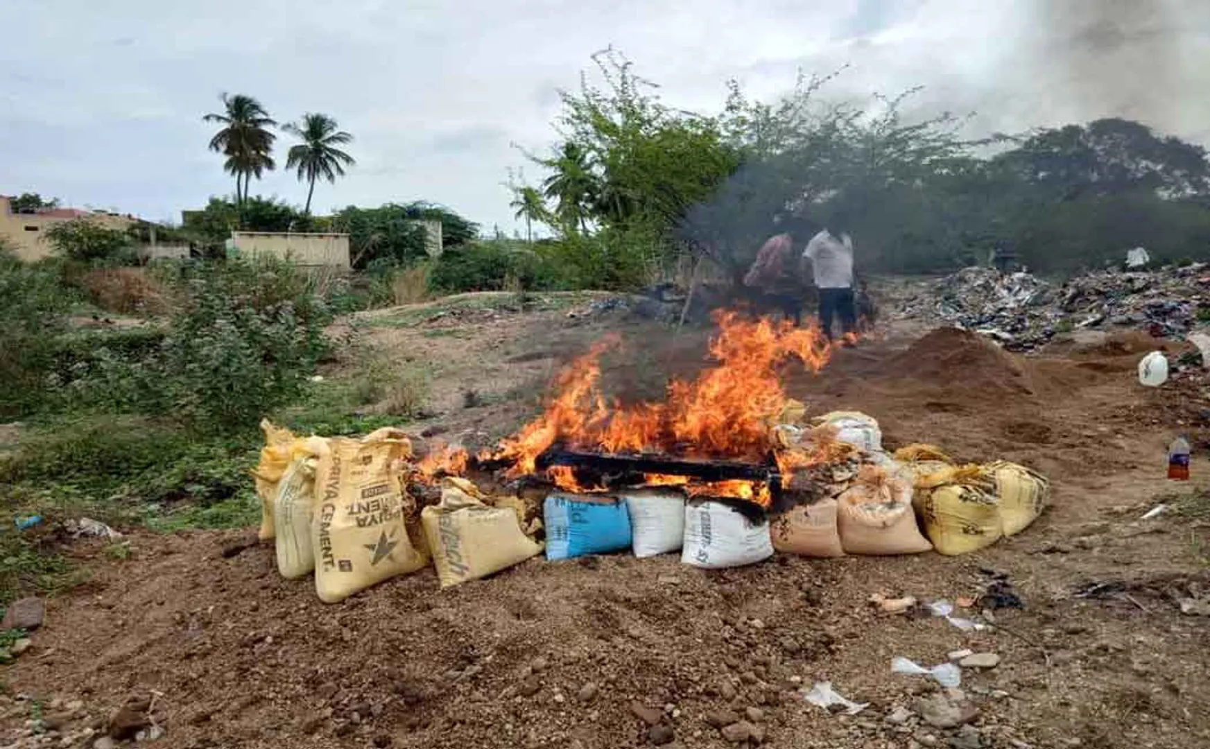  Flaming sand flames - smiling civilians in action VELLORE PALARU 